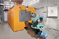 Caldera industrial de astilla Heizomat Somos distribuidores de calderas policombustible en Navarra Burgos Soria Palencia y Pais Vasco 
